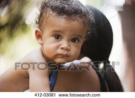 Stock Image - Close up of baby's face. Fotosearch