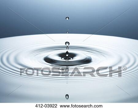 Stock Image - Close up of splashing water droplet. Fotosearch