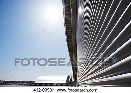Close up of warehouse wall and blue sky View Large Photo Image Stock Photo - Close up of warehouse wall and blue sky. Fotosearch