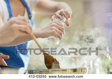 Couple cooking in kitchen View Large Photo Image Stock Photography - Couple cooking in kitchen. Fotosearch