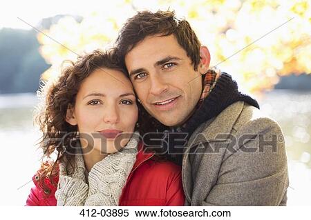 Couple hugging in park View Large Photo Image Stock Photography - Couple hugging in park. Fotosearch