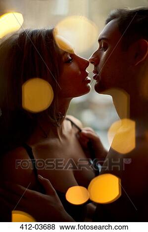 Couple kissing in bedroom View Large Photo Image Stock Photo - Couple kissing in bedroom. Fotosearch