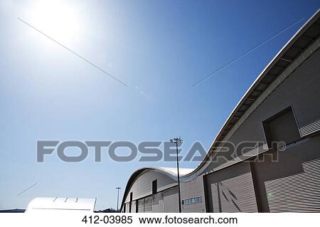 Curved roof of warehouse and blue sky View Large Photo Image Stock Photography - Curved roof of warehouse and blue sky. Fotosearch