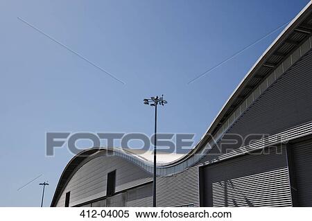 Curved roof of warehouse and blue sky View Large Photo Image Stock Photography - Curved roof of warehouse and blue sky. Fotosearch