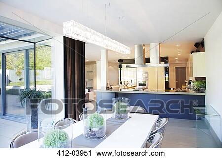 Dining room and kitchen in modern home View Large Photo Image Stock Image - Dining room and kitchen in modern home. Fotosearch