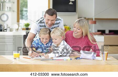 Family coloring together at table View Large Photo Image Stock Image - Family coloring together at table. Fotosearch