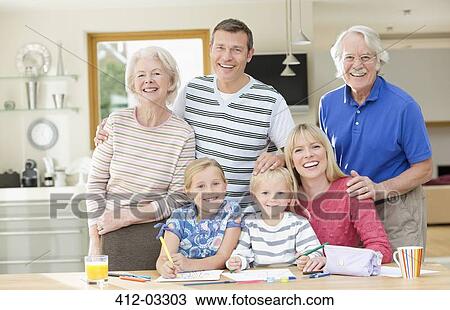 Family smiling together in kitchen View Large Photo Image Stock Image - Family smiling together in kitchen. Fotosearch