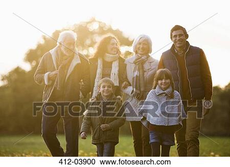 Family walking together in park View Large Photo Image Stock Image - Family walking together in park. Fotosearch