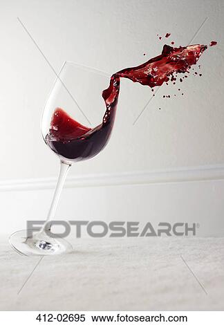 Glass of red wine spilling View Large Photo Image Stock Photography - Glass of red wine spilling. Fotosearch