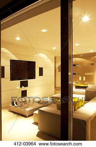 Illuminated living room of modern home View Large Photo Image Picture - Illuminated living room of modern home. Fotosearch