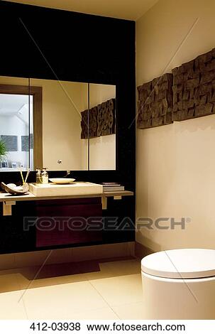 Stock Photo - Mirror and sink in modern bathroom. Fotosearch