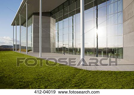 Modern building and green lawn View Large Photo Image Stock Photo - Modern building and green lawn. Fotosearch