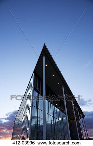 Stock Photograph - Modern building and sunset sky. Fotosearch
