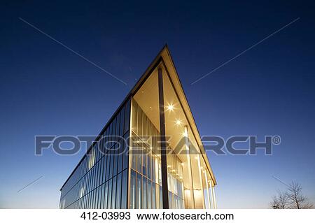 Modern building illuminated at dusk View Large Photo Image Stock Image - Modern building illuminated at dusk. Fotosearch