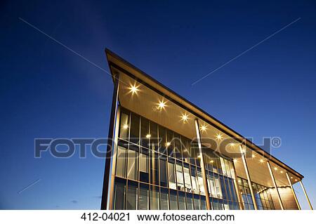 Modern building illuminated at dusk View Large Photo Image Stock Image - Modern building illuminated at dusk. Fotosearch