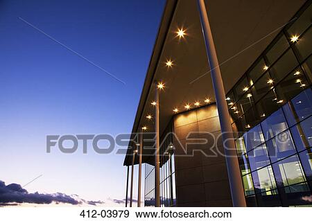 Modern building illuminated at sunset View Large Photo Image Stock Photo - Modern building illuminated at sunset. Fotosearch