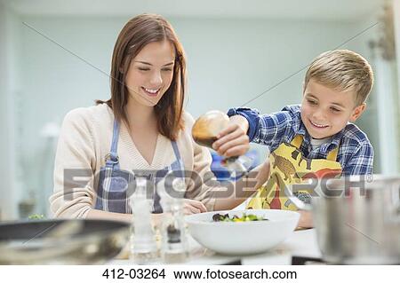 Mother and son making salad in kitchen View Large Photo Image Picture - Mother and son making salad in kitchen. Fotosearch