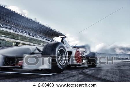 Race car driving on track View Large Photo Image Stock Photo - Race car driving on track. Fotosearch
