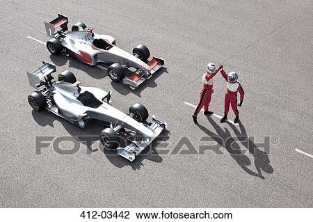 Stock Image - Racers cheering on track. Fotosearch
