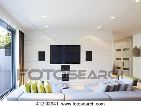 Stock Image - Sofa and television in modern living room. Fotosearch