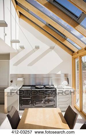 Stove and table in modern kitchen View Large Photo Image Stock Photo - Stove and table in modern kitchen. Fotosearch