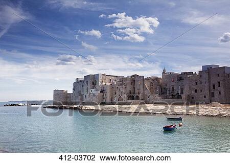 Stock Image - Town on island in still rural lake. Fotosearch