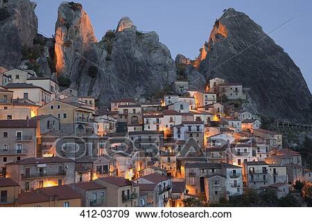 Stock Photo - Village on hillside in rural landscape. Fotosearch
