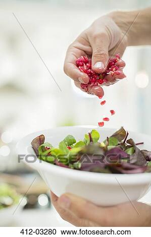 Woman making salad in kitchen View Large Photo Image Stock Image - Woman making salad in kitchen. Fotosearch