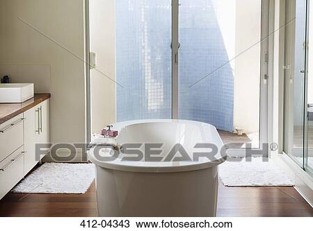 Bathtub in modern bathroom View Large Photo Image Stock Image - Bathtub in modern bathroom. Fotosearch