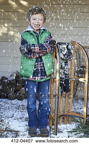 Boy with wooden sled in snow View Large Photo Image Stock Photo - Boy with wooden sled in snow. Fotosearch