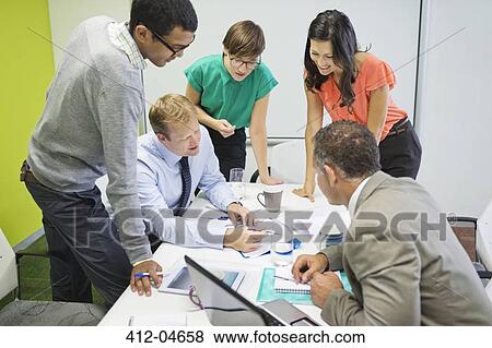 Business people talking in meeting View Large Photo Image Stock Photo - Business people talking in meeting. Fotosearch