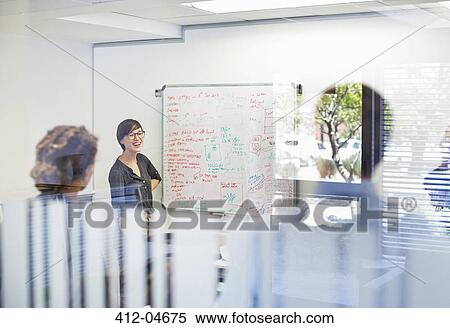 Stock Photography - Business people talking in meeting. Fotosearch