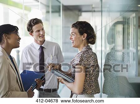 Business people talking in office View Large Photo Image Stock Photo - Business people talking in office. Fotosearch