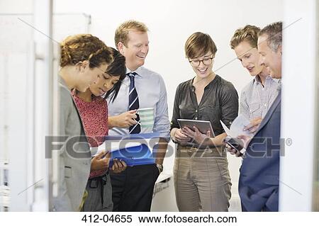 Business people talking in office View Large Photo Image Stock Photography - Business people talking in office. Fotosearch