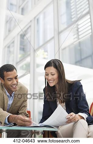 Stock Image - Business people talking outdoors. Fotosearch