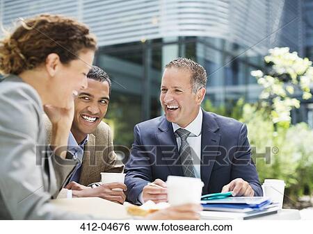 Business people talking outdoors View Large Photo Image Stock Photograph - Business people talking outdoors. Fotosearch