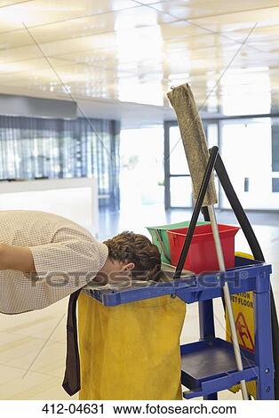 Businessman putting face in trash bag View Large Photo Image Stock Image - Businessman putting face in trash bag. Fotosearch