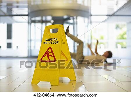Businessman slipping on wet office floor View Large Photo Image Picture - Businessman slipping on wet office floor. Fotosearch