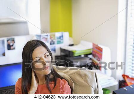 Businesswoman sitting at desk View Large Photo Image Stock Image - Businesswoman sitting at desk. Fotosearch