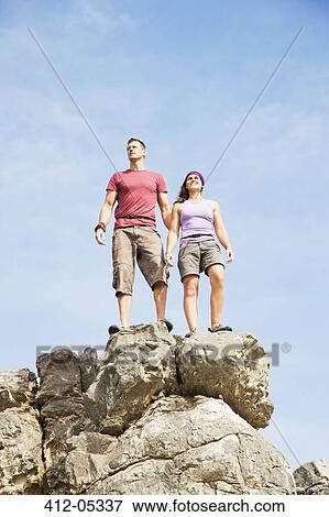 Climbers on rocky hilltop View Large Photo Image Stock Photo - Climbers on rocky hilltop. Fotosearch