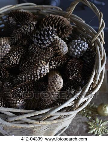 Stock Photo - Close up of basket of pine cones. Fotosearch
