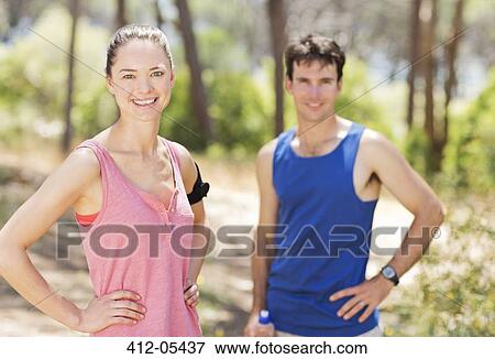 Couple resting during workout outdoors View Large Photo Image Stock Photo - Couple resting during workout outdoors. Fotosearch