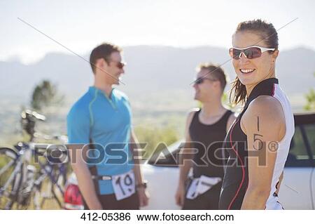 Cyclists talking before race View Large Photo Image Stock Photograph - Cyclists talking before race. Fotosearch