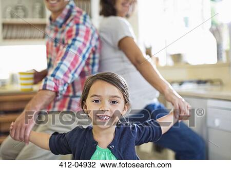 Family holding hands in kitchen View Large Photo Image Stock Image - Family holding hands in kitchen. Fotosearch
