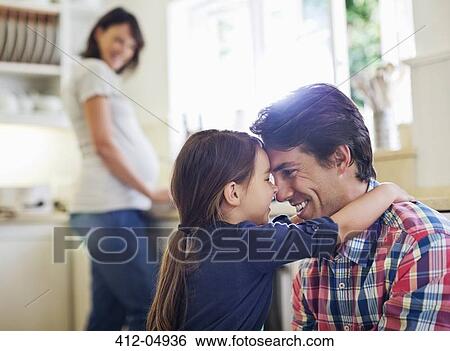 Father and daughter hugging in kitchen View Large Photo Image Stock Photograph - Father and daughter hugging in kitchen. Fotosearch