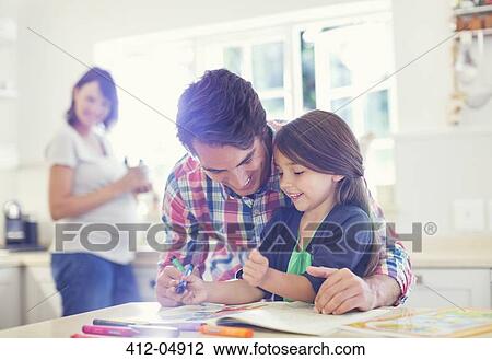 Father helping daughter use coloring book View Large Photo Image Stock Image - Father helping daughter use coloring book. Fotosearch