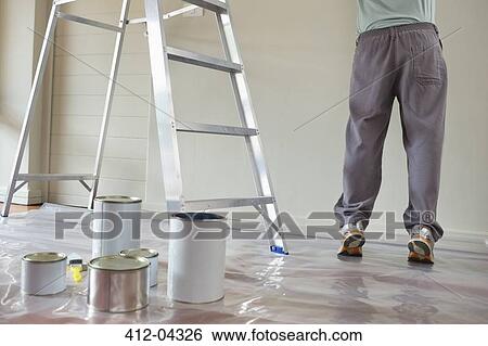 Man painting in room View Large Photo Image Stock Photograph - Man painting in room. Fotosearch
