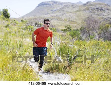 Man running on dirt path View Large Photo Image Stock Photography - Man running on dirt path. Fotosearch