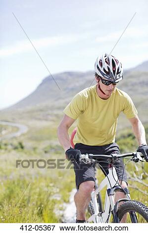 mountain biker on dirt path View Large Photo Image Stock Photo - mountain biker on dirt path. Fotosearch