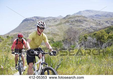 mountain bikers on dirt path View Large Photo Image Stock Image - mountain bikers on dirt path. Fotosearch